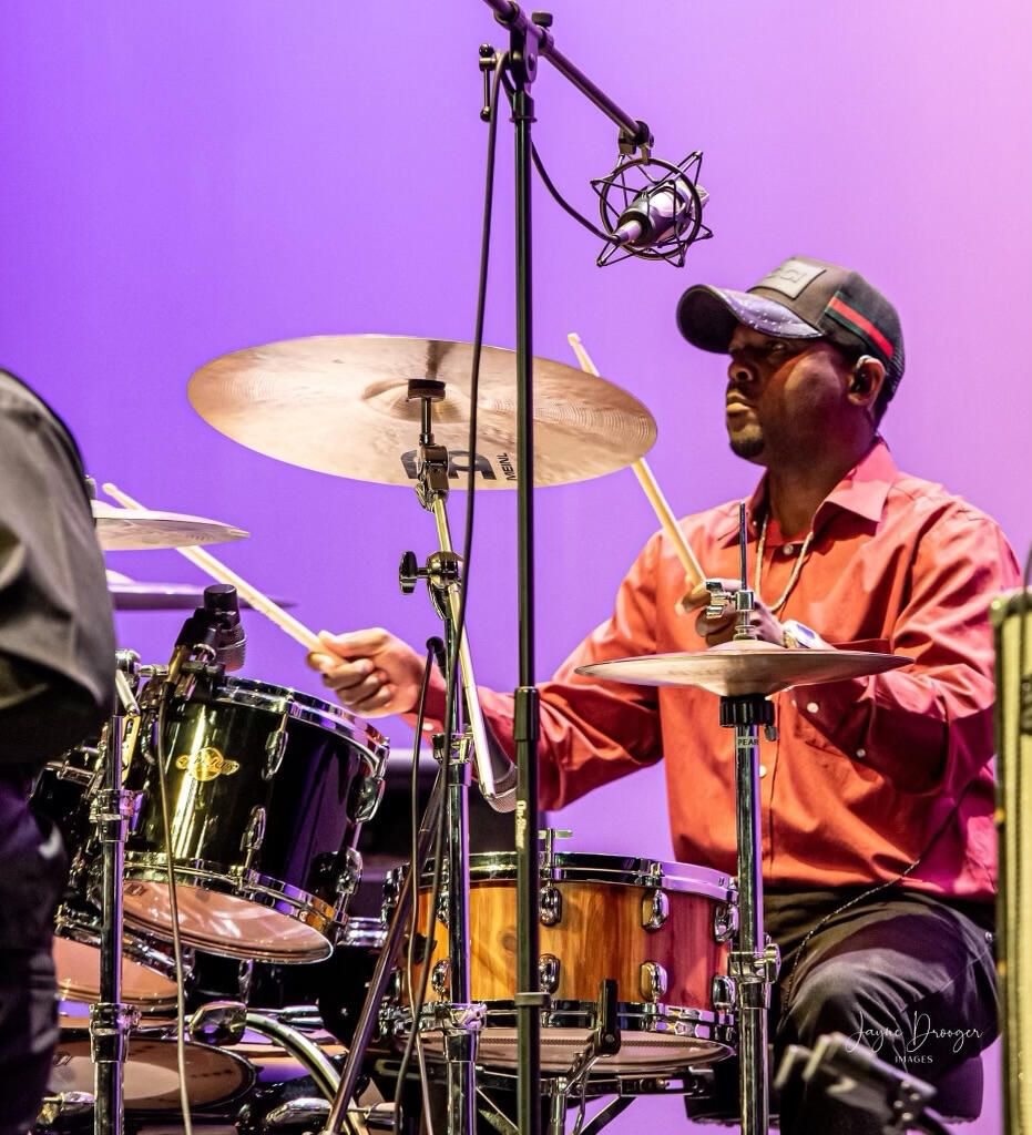 Richard Floyd playing drums on stage